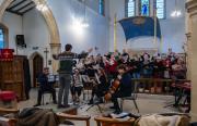 Rehearsal - full choir with Tom - cropped 2